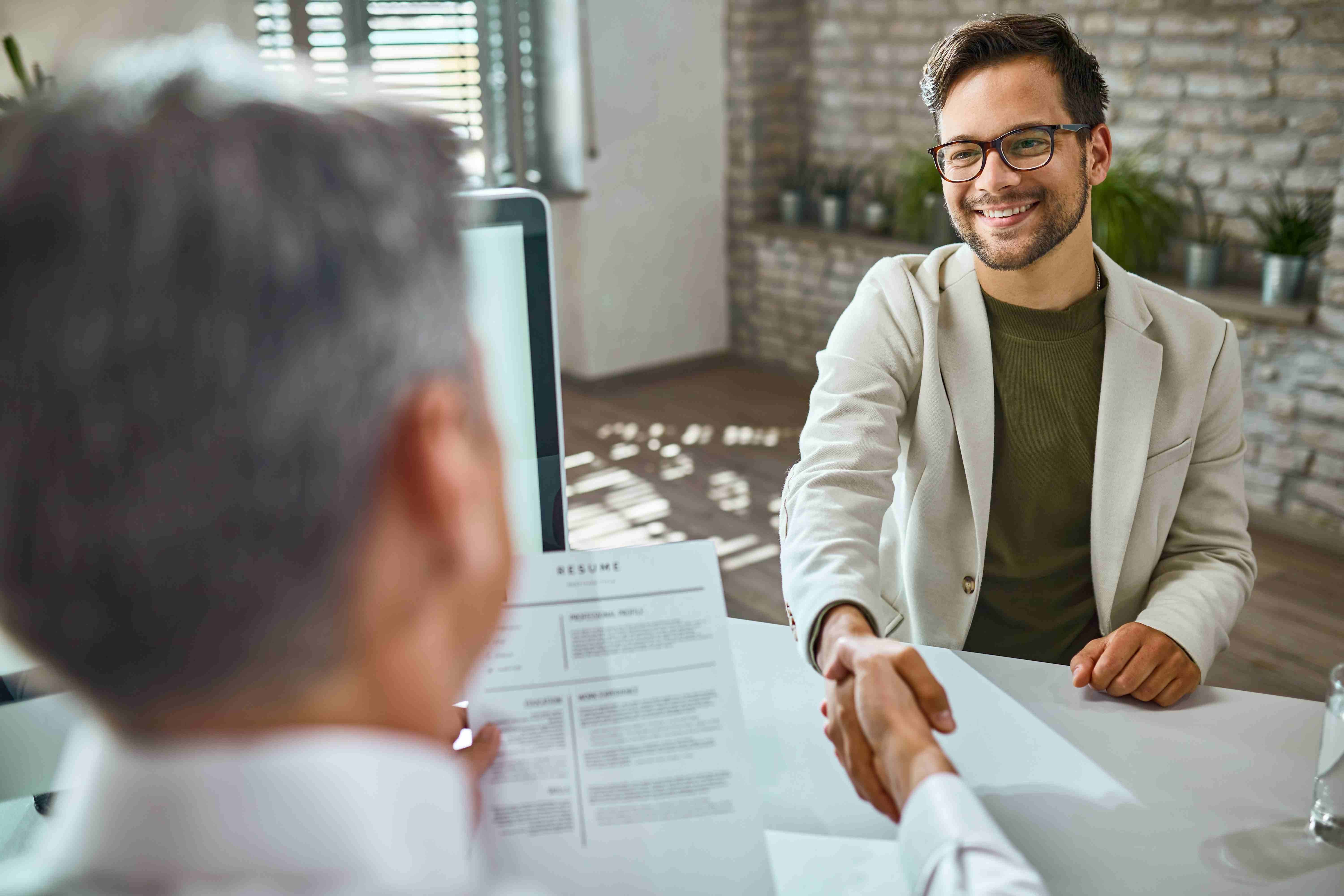 Two people discussing hiring